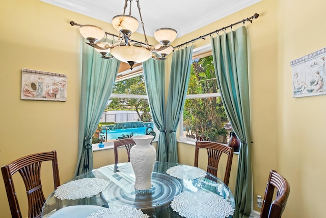 dining room featuring an inviting chandelier and crown molding