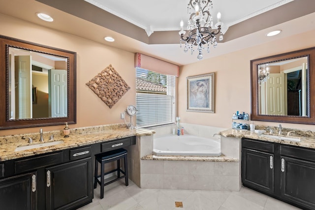 bathroom with vanity, an inviting chandelier, a relaxing tiled tub, and crown molding