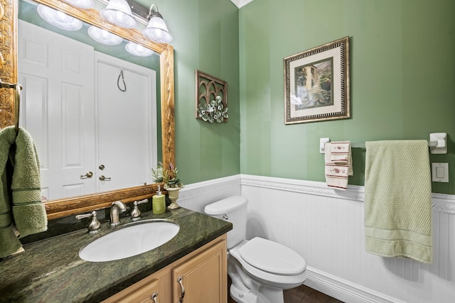 bathroom with toilet and vanity