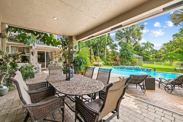 view of patio / terrace with a fenced in pool