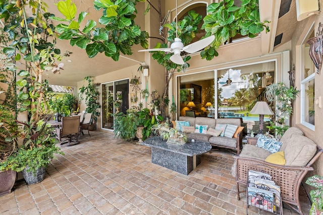 view of patio / terrace featuring ceiling fan and an outdoor living space