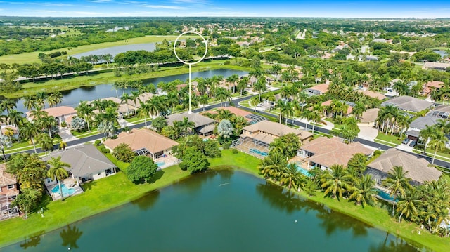 drone / aerial view with a water view