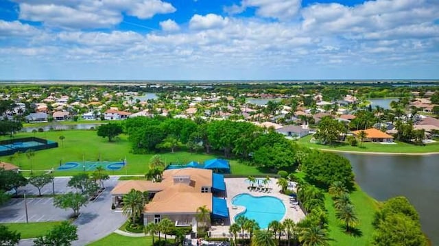 birds eye view of property featuring a water view