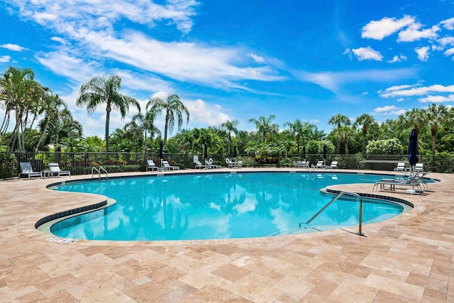 view of swimming pool with a patio area