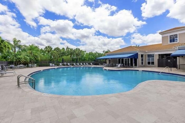 view of swimming pool with a patio area