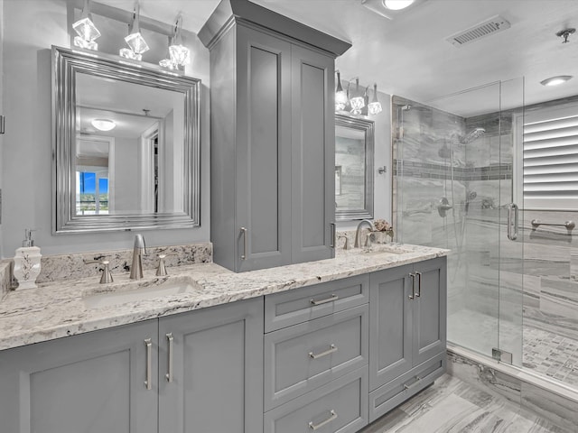 bathroom featuring vanity and walk in shower