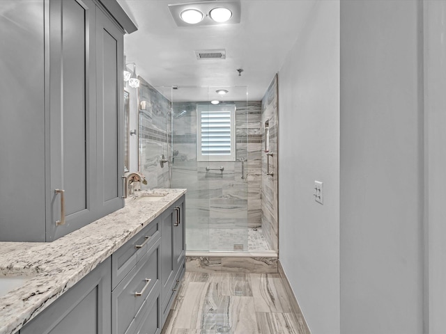 bathroom featuring vanity and walk in shower