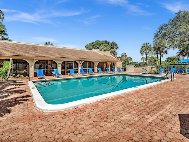 view of swimming pool featuring a patio area