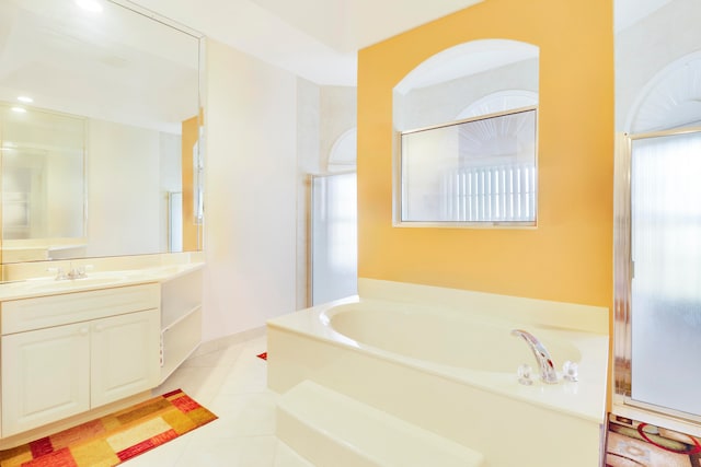 bathroom featuring vanity, plus walk in shower, and tile patterned floors