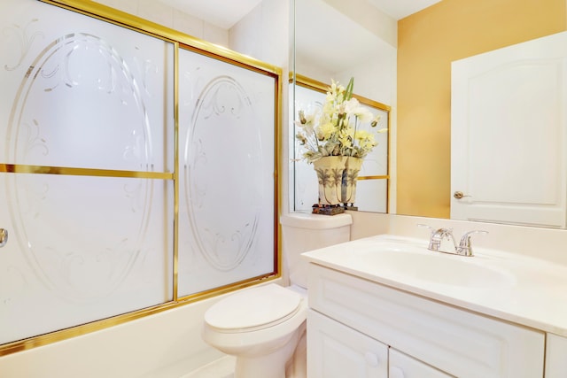 full bathroom with shower / bath combination with glass door, vanity, and toilet