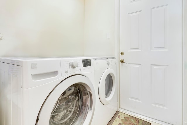 washroom featuring washing machine and dryer