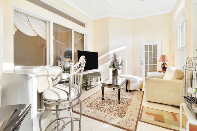 living room featuring crown molding and light tile patterned flooring