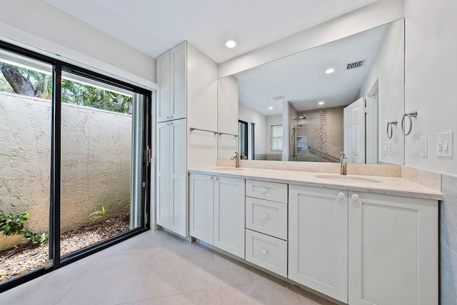 bathroom with vanity and tile patterned flooring