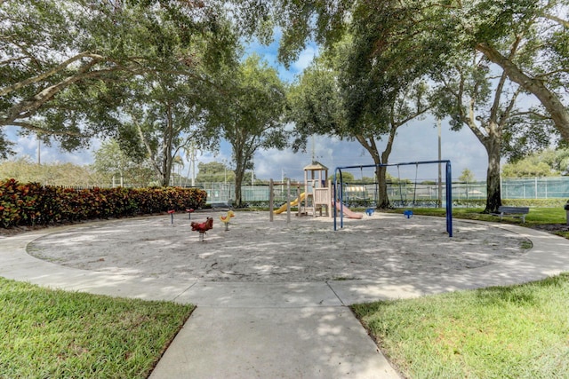 view of property's community with a playground