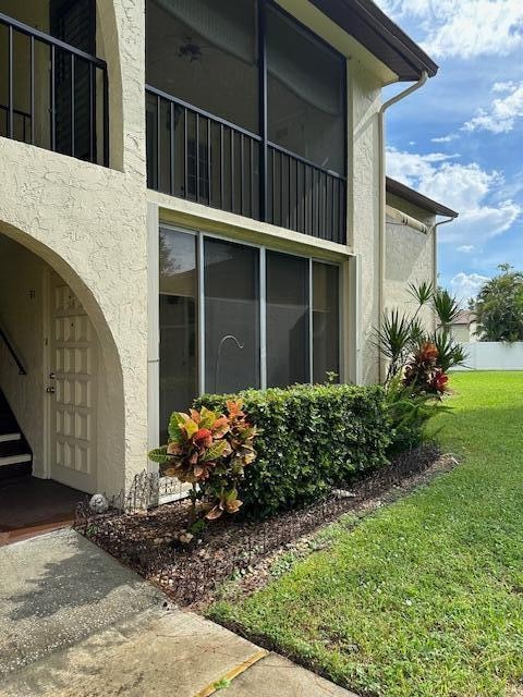 view of property exterior featuring a yard