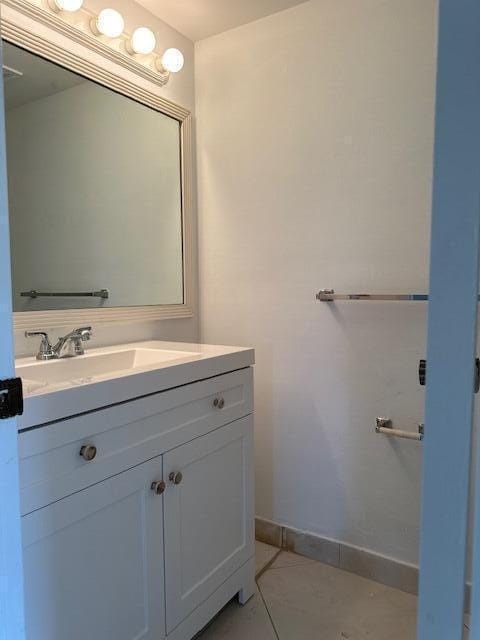 3625 La Aires Ct Unit B-1, Greenacres, FL 33463 - bathroom with tile patterned floors, vanity, and baseboards