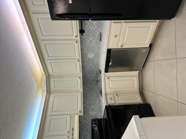 kitchen with tile walls