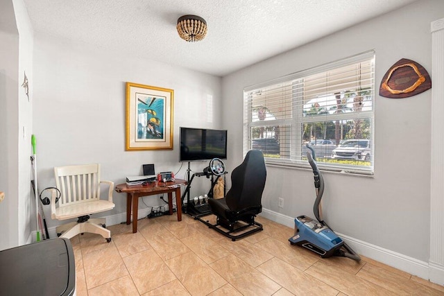 workout area featuring a textured ceiling