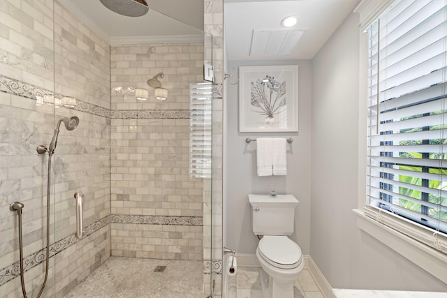 bathroom with a healthy amount of sunlight, ornamental molding, toilet, and a shower with shower door