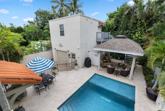 view of swimming pool featuring a gazebo and a patio area