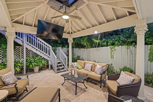 view of patio featuring ceiling fan, an outdoor living space, and a gazebo