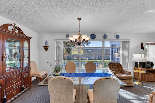 carpeted dining area featuring a textured ceiling and a chandelier