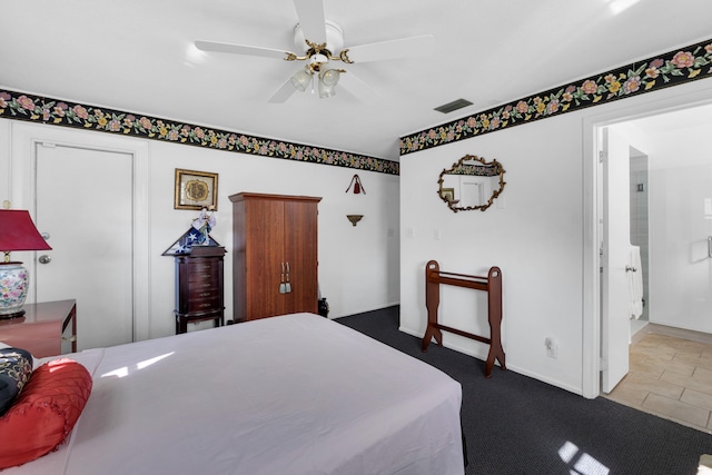 bedroom with ceiling fan and ensuite bathroom