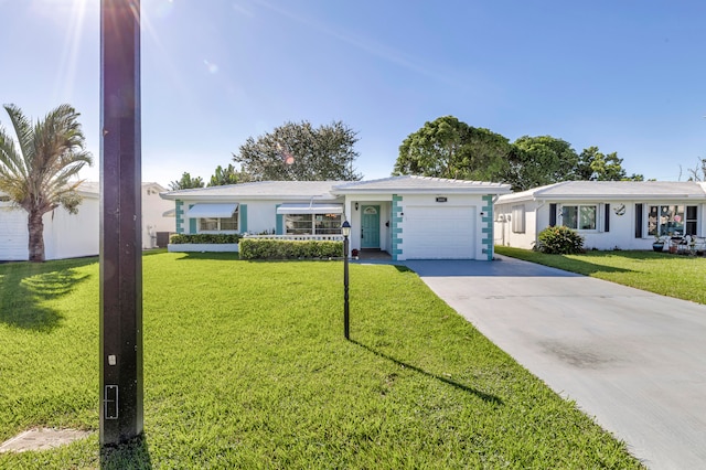 ranch-style home featuring a front lawn and a garage