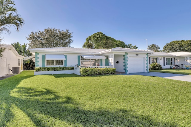 single story home featuring a front yard, a garage, and central AC