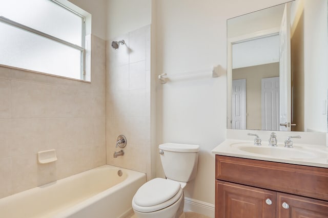 full bathroom featuring vanity, toilet, and tiled shower / bath