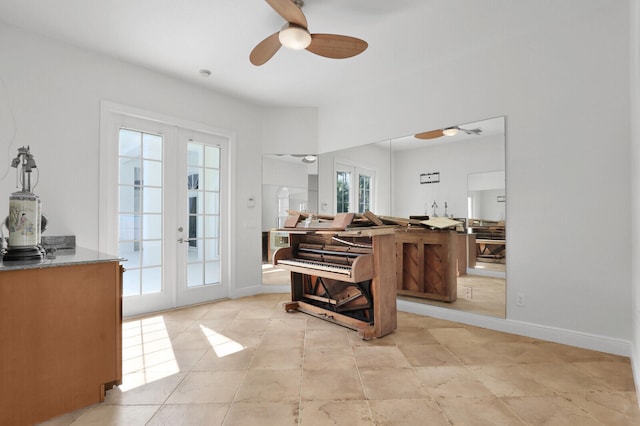 miscellaneous room featuring a healthy amount of sunlight, ceiling fan, and french doors