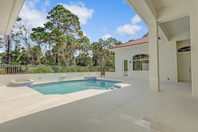 view of swimming pool with a patio