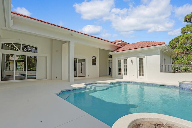 view of swimming pool featuring a patio area