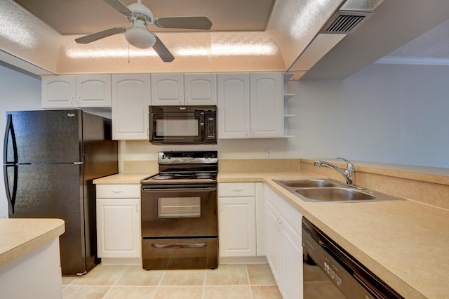 kitchen with white cabinets, black appliances, ceiling fan, and sink