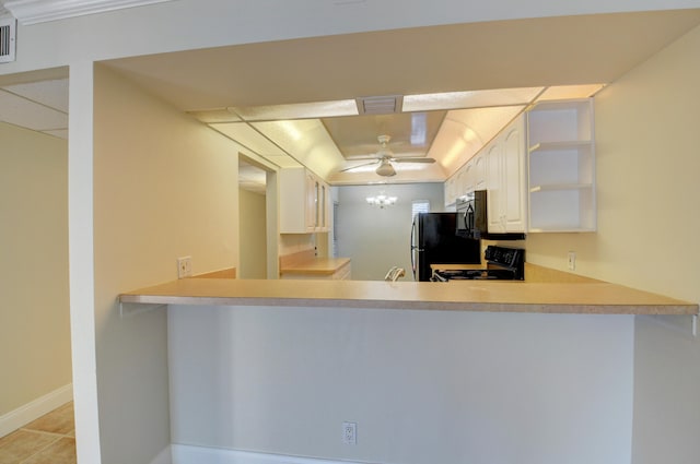 kitchen featuring black appliances, kitchen peninsula, ceiling fan, and white cabinets