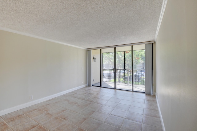 empty room with a textured ceiling, crown molding, and floor to ceiling windows