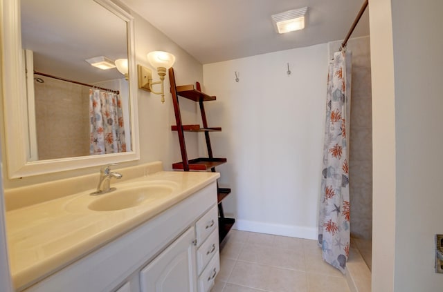 bathroom with a shower with shower curtain, tile patterned floors, and vanity