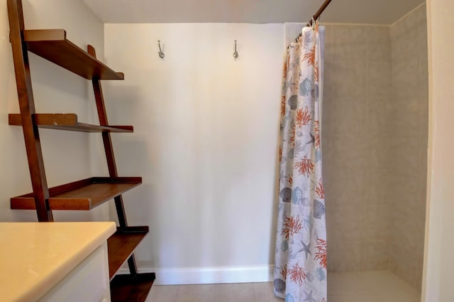 interior space featuring vanity and a shower with shower curtain