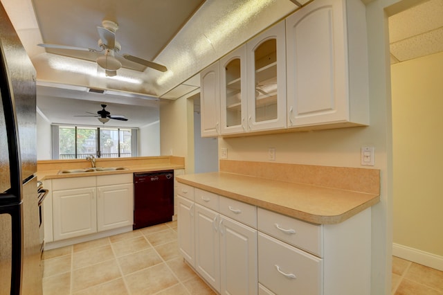 kitchen featuring light tile patterned floors, dishwasher, ceiling fan, and sink