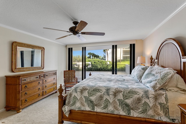 carpeted bedroom with ornamental molding, a textured ceiling, access to exterior, and ceiling fan