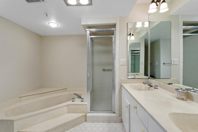 bathroom with vanity, plus walk in shower, and tile patterned floors