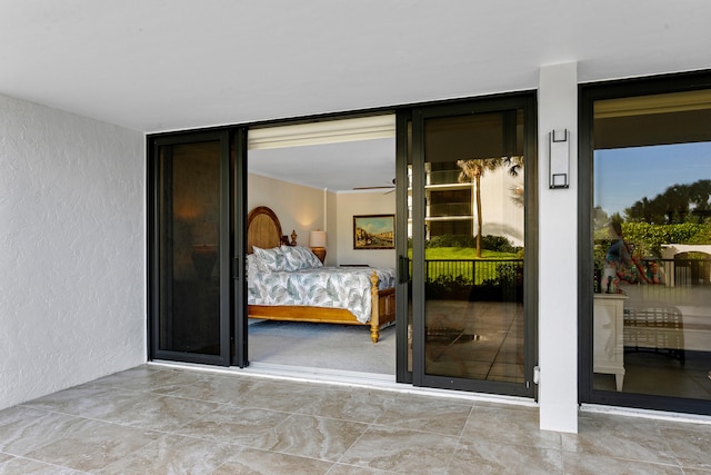 bedroom featuring floor to ceiling windows