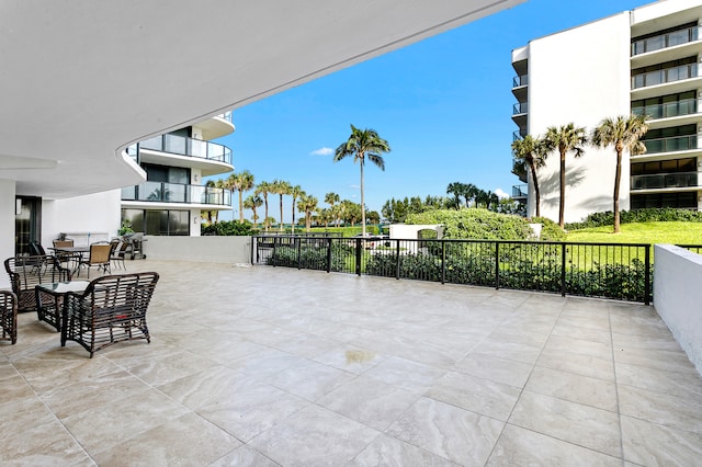 view of patio featuring a balcony