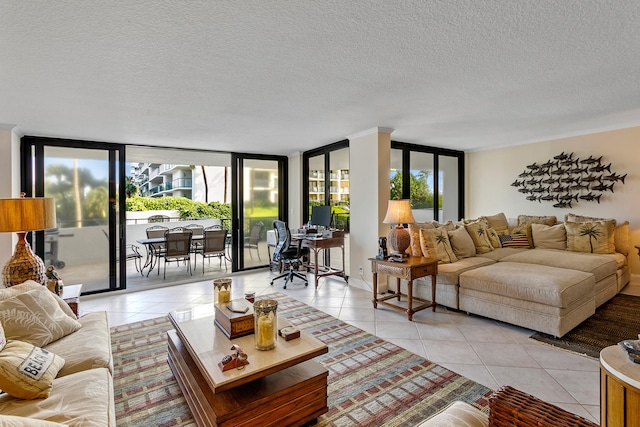 living room with a healthy amount of sunlight, light tile patterned flooring, and floor to ceiling windows