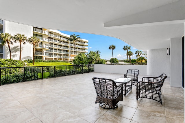 view of patio featuring a balcony