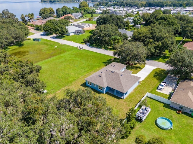 birds eye view of property with a water view