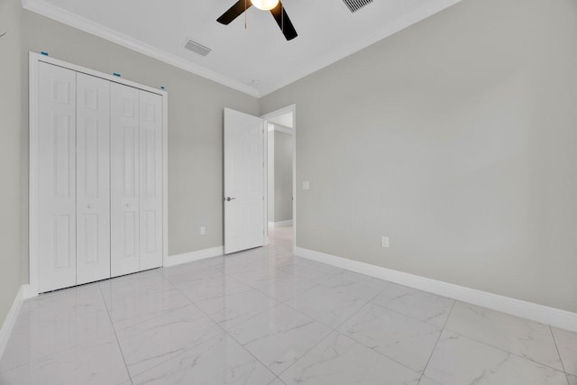 unfurnished bedroom featuring ceiling fan, a closet, and ornamental molding