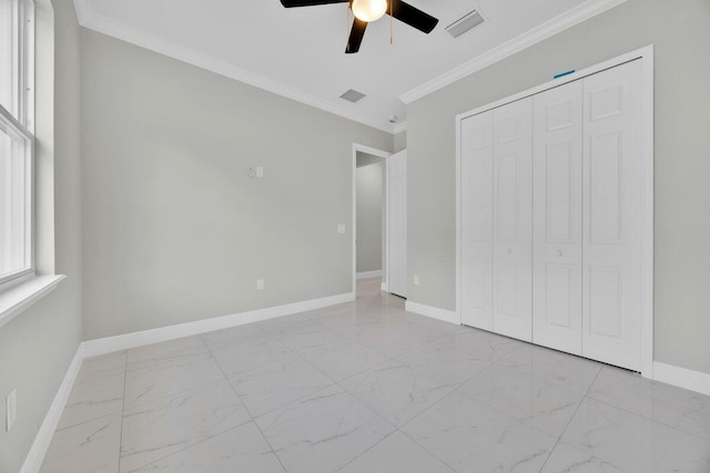 unfurnished bedroom with ceiling fan, a closet, and ornamental molding