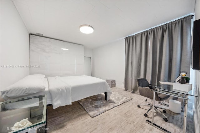 bedroom featuring hardwood / wood-style floors