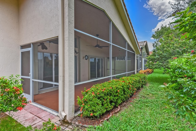 view of home's exterior featuring ceiling fan